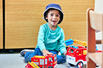 Child at SuperCamps with toys