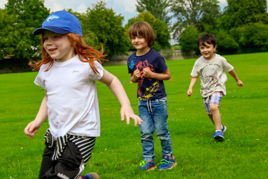 children running outdoors