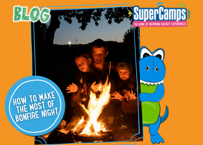 Children and parents dressed warmly watching fireworks at a school bonfire night