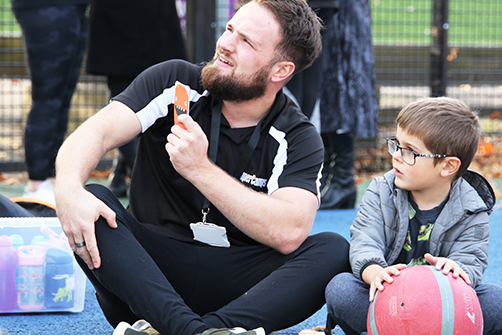 Child and instructor during Mindful Monster activity