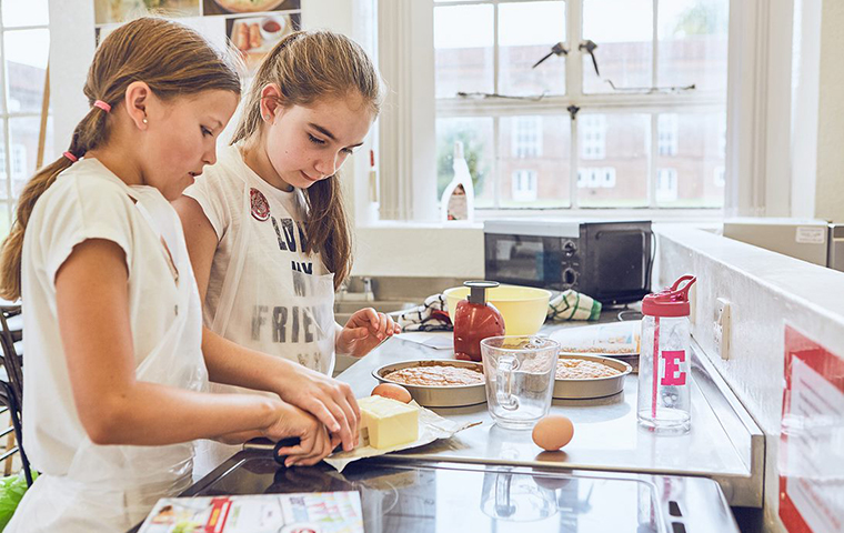Girls baking on cookery course