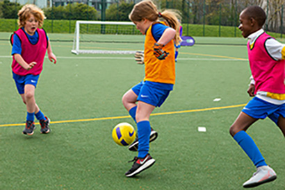Girl playing football at SuperCamps Specialist Course