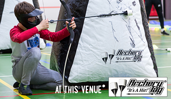 Child aiming whilst part of an Archery Tag game