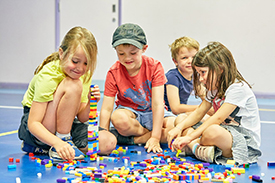 Boys and girls with LEGO at Multi-Activity camp
