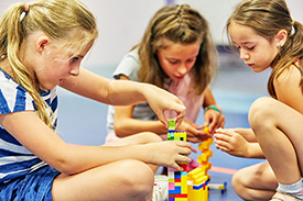 Children playing with LEGO at SuperCamps