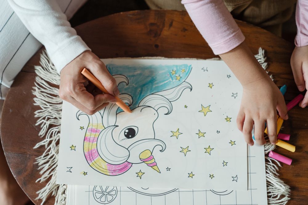 child and adult colouring unicorn